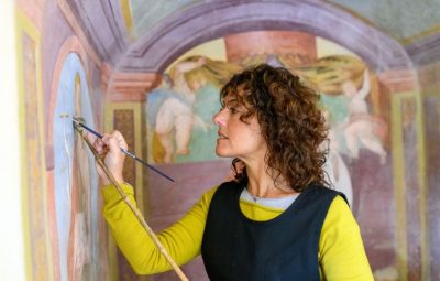 Conservator restoring a fresco to support conservation documentation and collection care in TMS Conservation Studio.