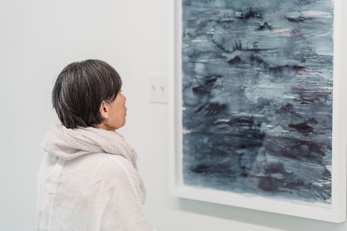 art collector looking at a potential artwork purchase.