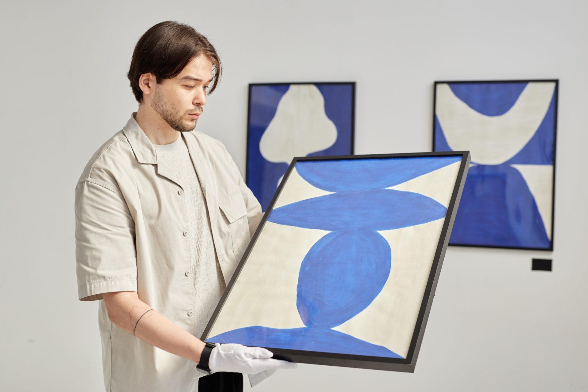 art hander working on installing a forthcoming exhibition