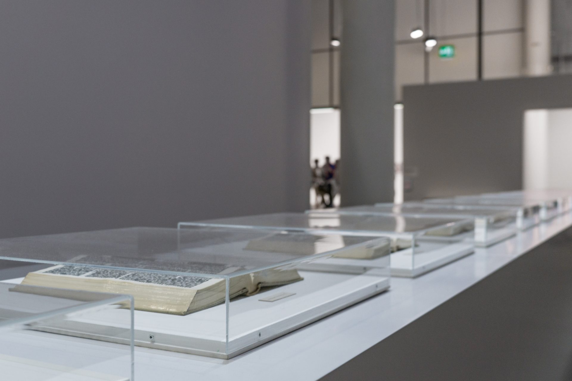 historic book archived under glass at a museum