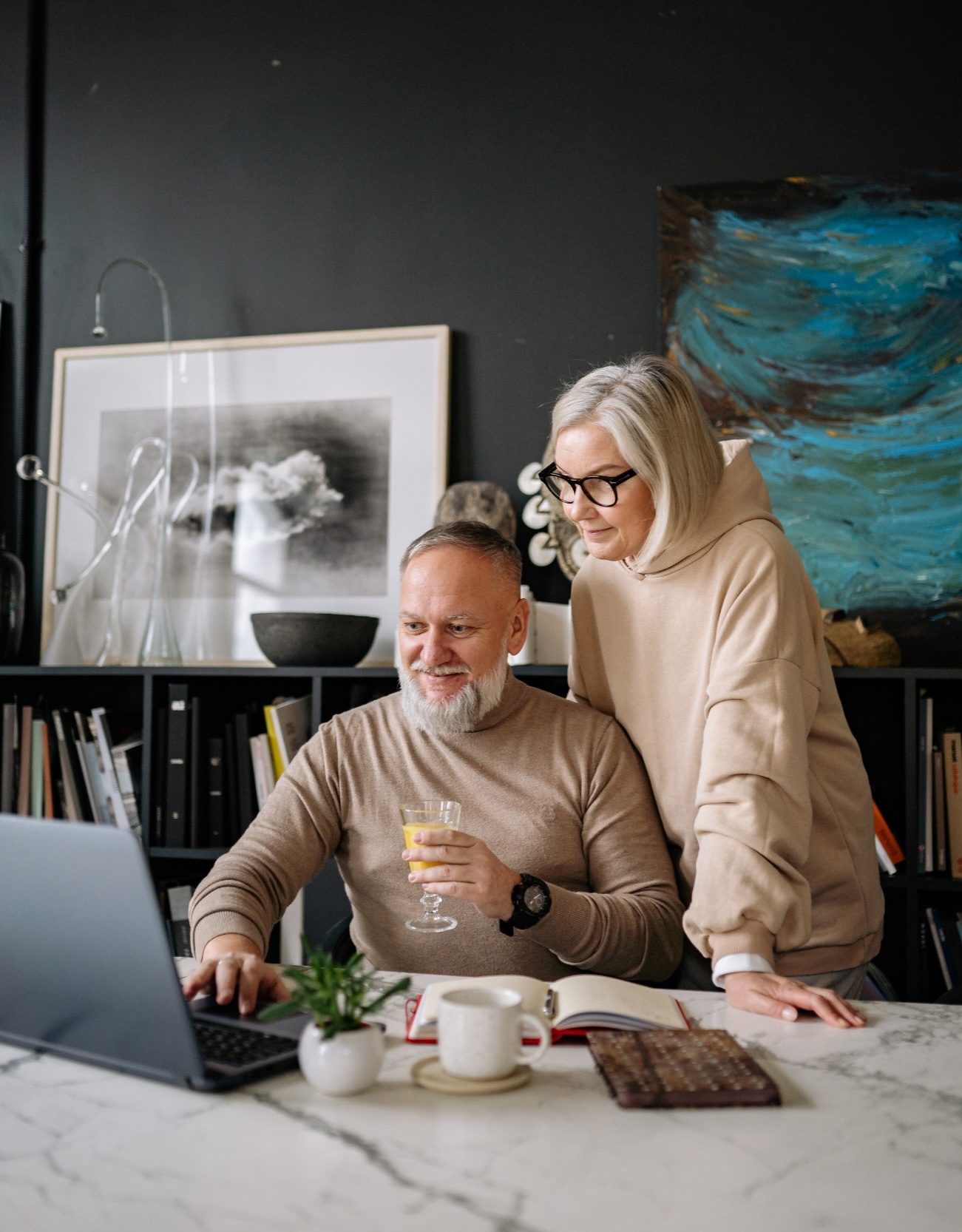 couple looking over their digital collection of art.