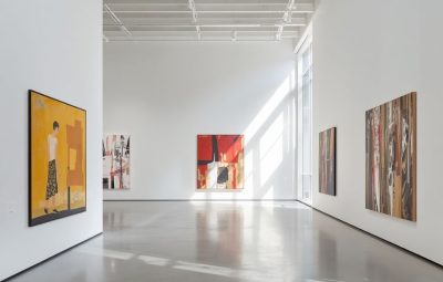 A bright, empty contemporary gallery with large abstract paintings, representing the collections environments EmbARK is designed to support