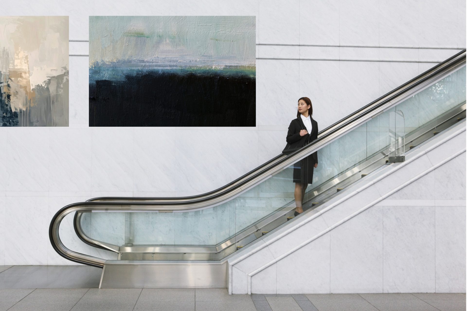 corporate collection of paintings in the lobby of a building.