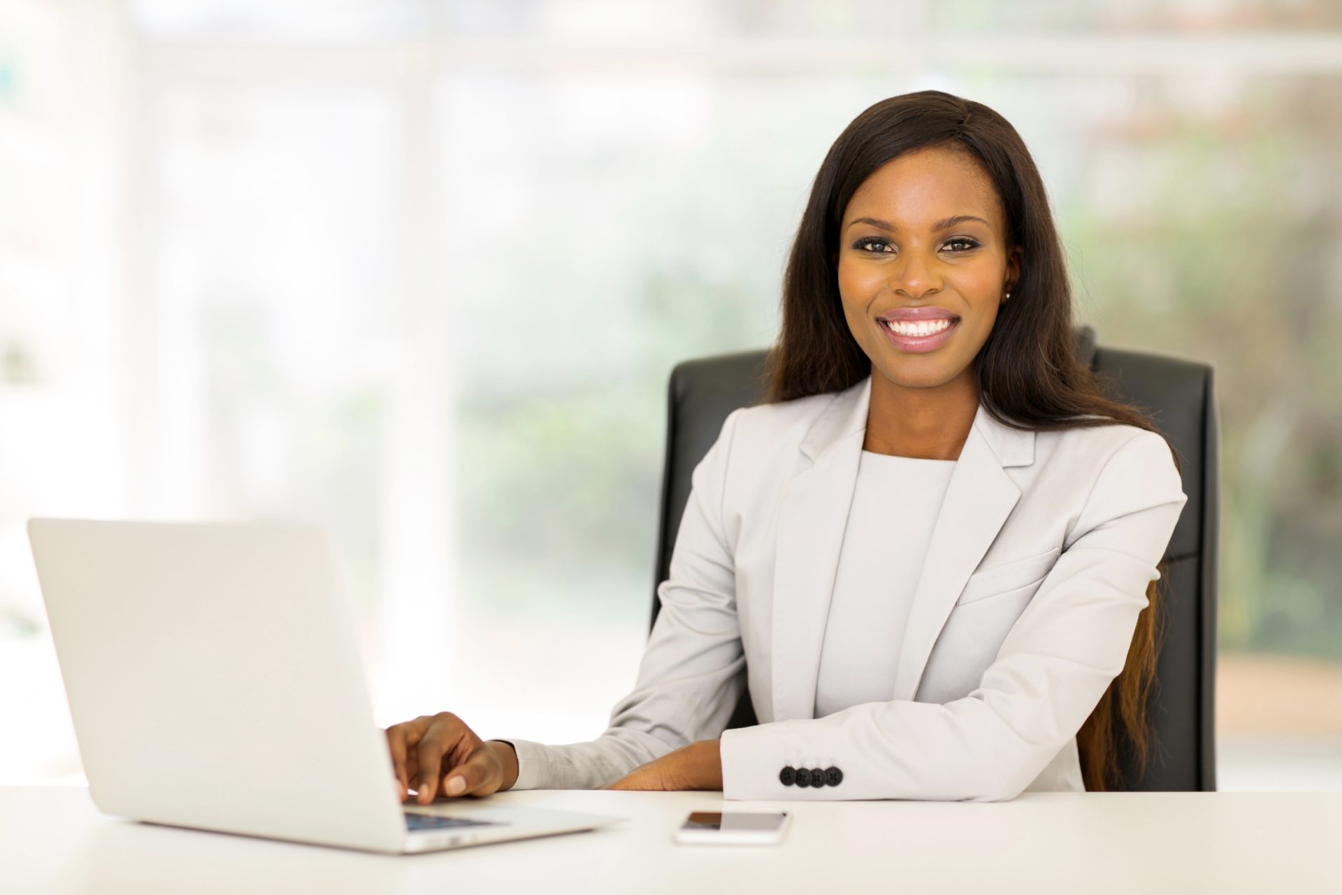corporate collections manager working at her desk.