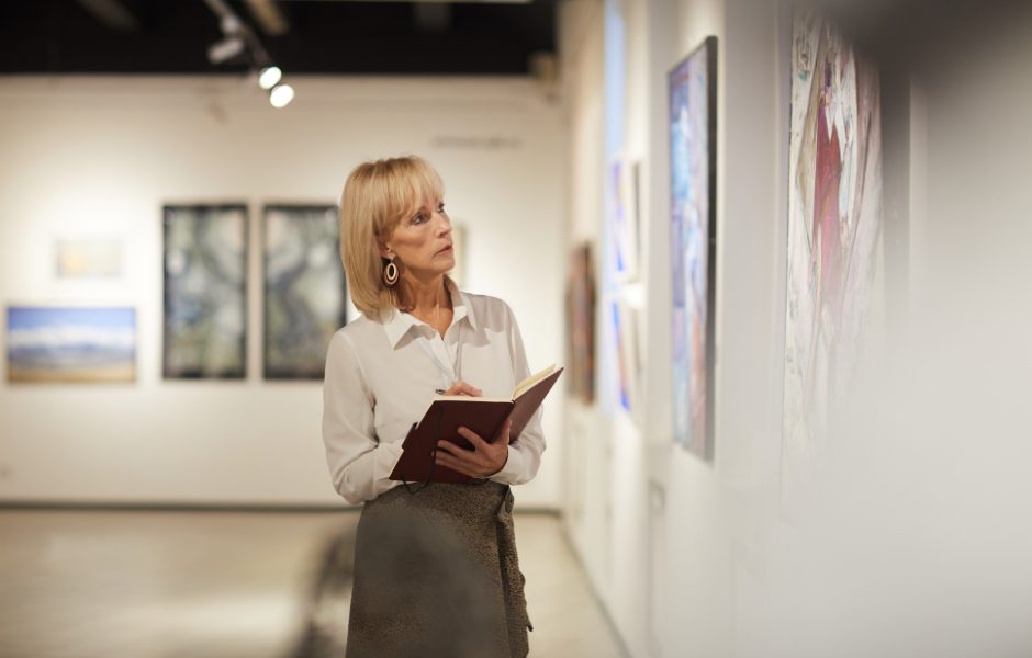 museum staff evaluating artwork