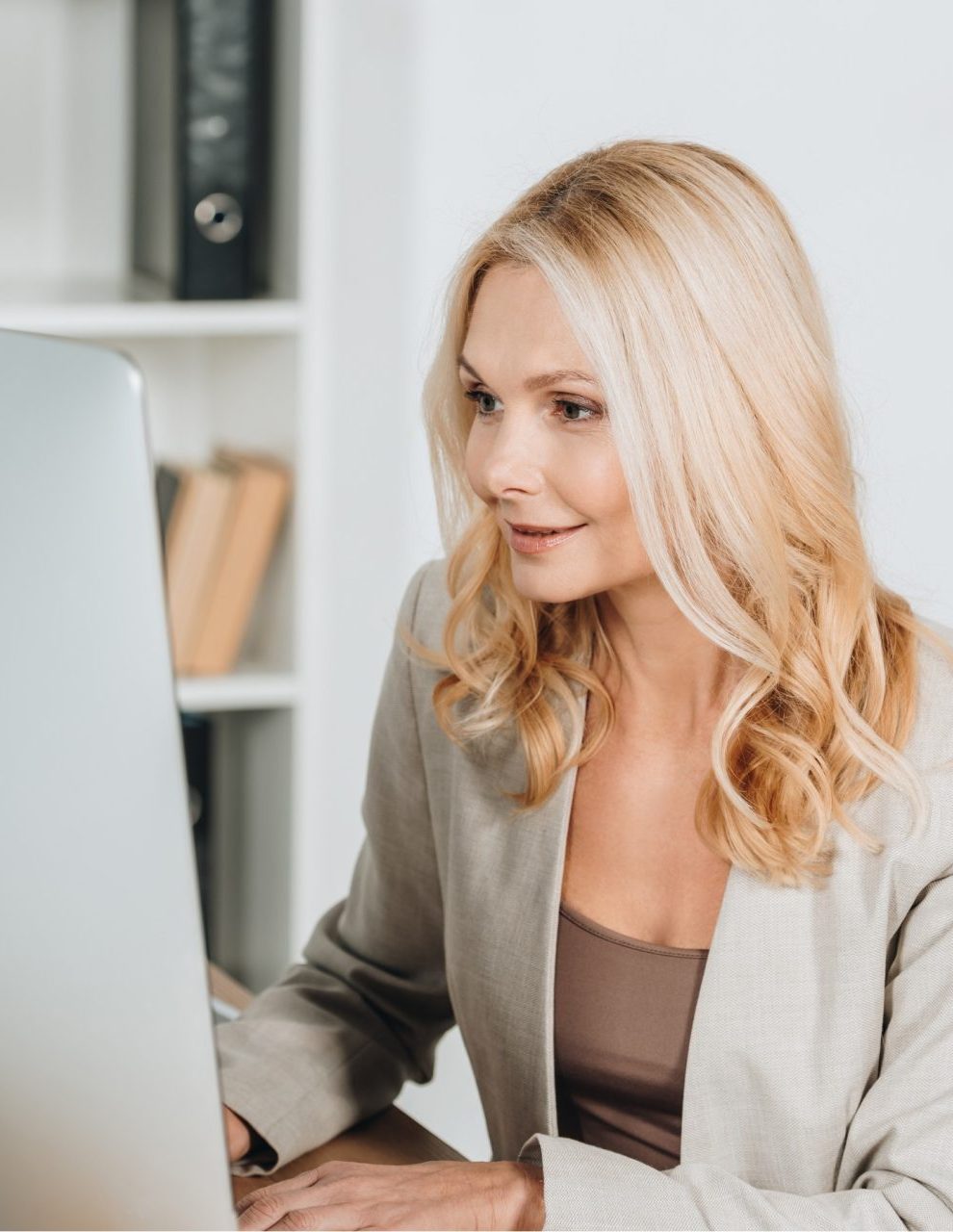 gallerist working at desktop at gallery