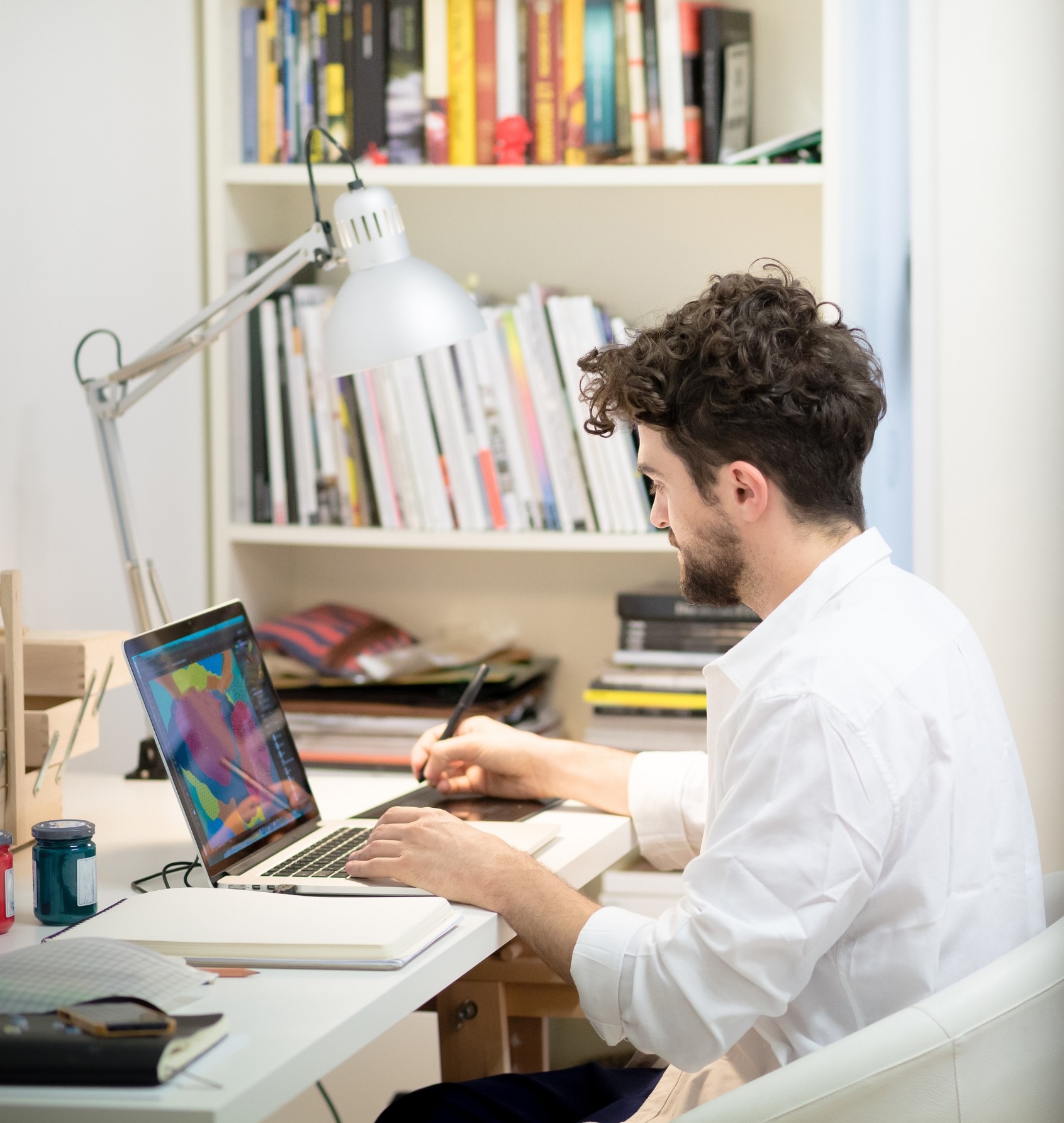 gallery associate working in the gallery office