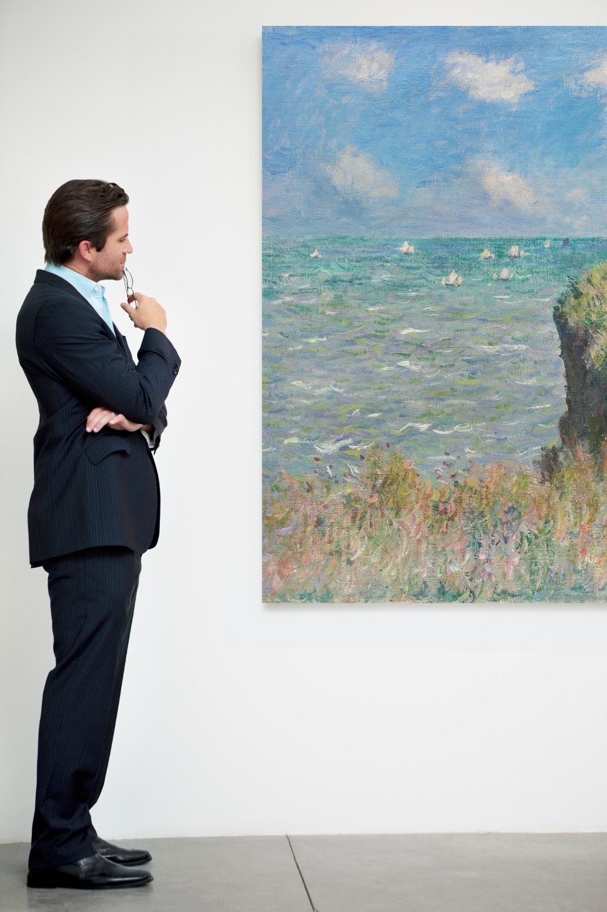 gallery owner reviewing a new painting
