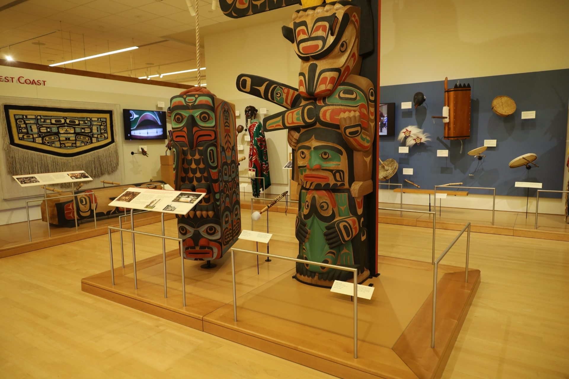 history museum exhibition displaying native artifacts.