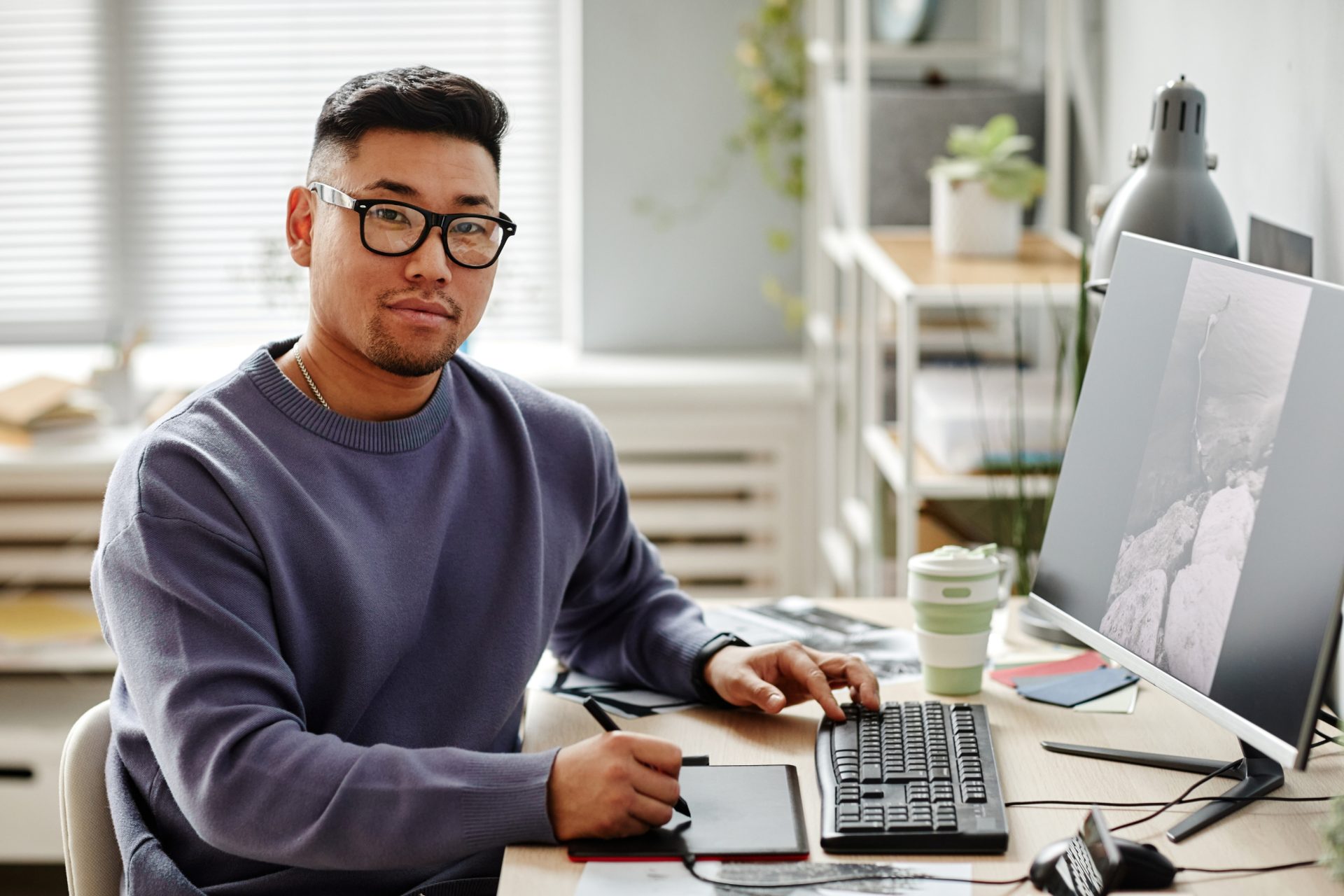 museum media manager working in office