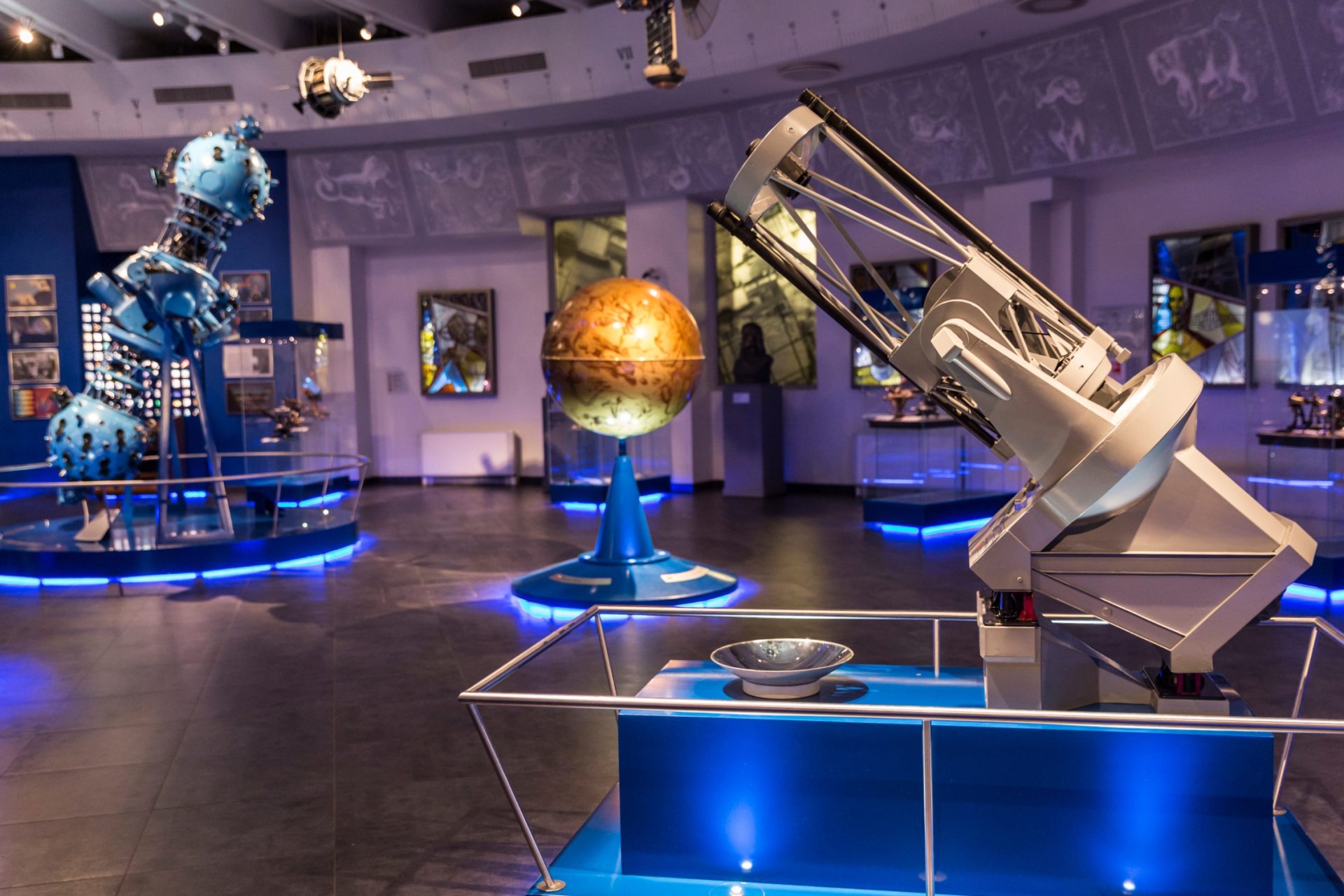 museum featuring a display of space and telescope equipment.
