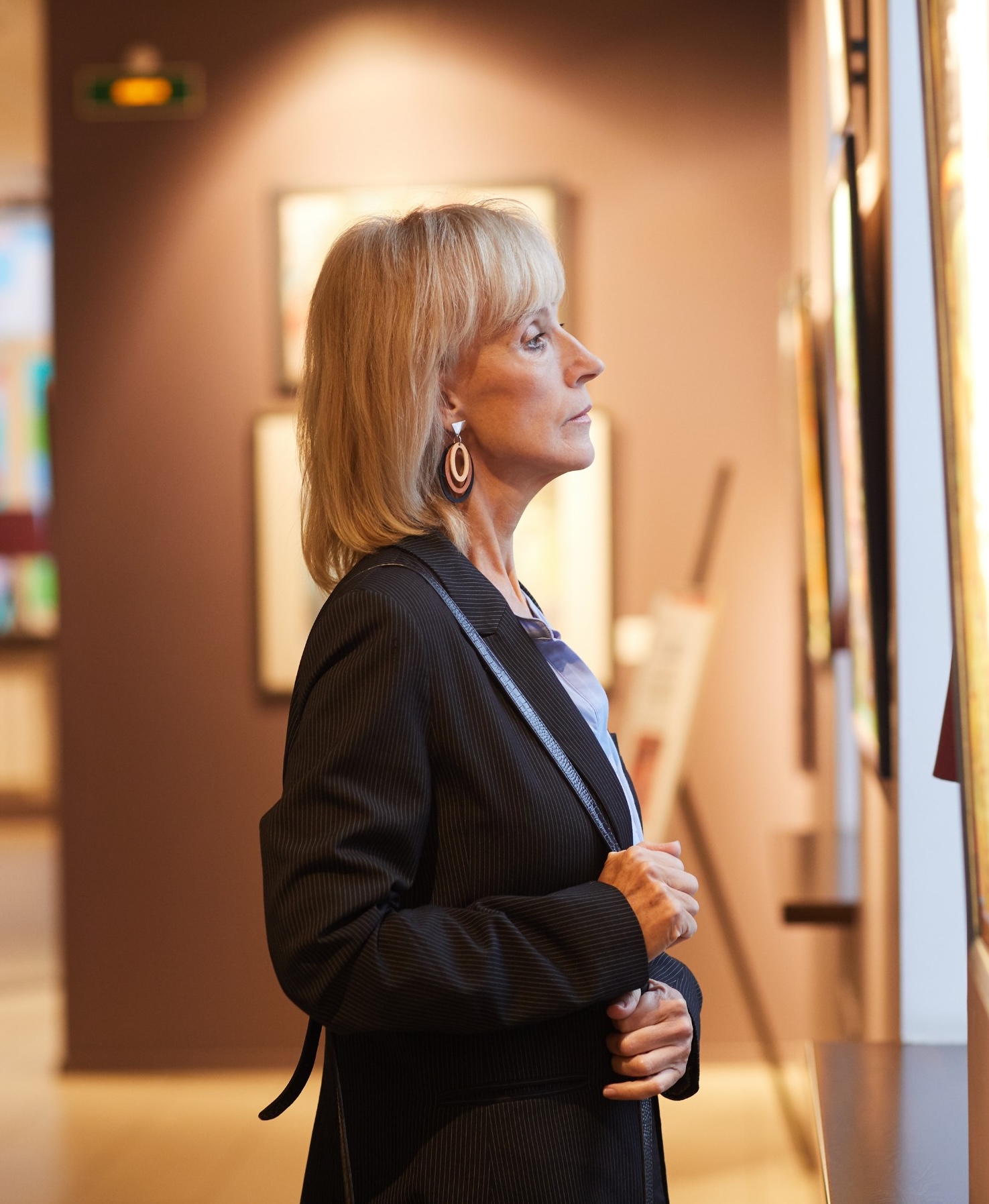 museum visitor looking at fine art.