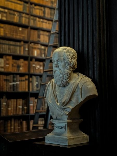 Bust of Socrates in a university library representing the academic collections institutions manage with Gallery Systems.
