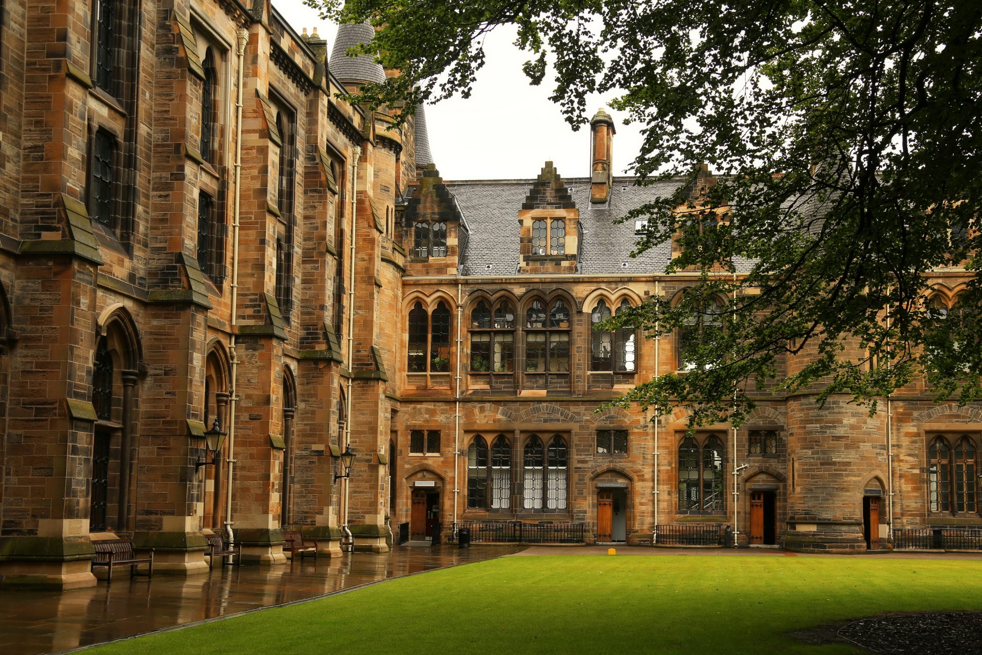 university grounds, green grass and historic old brick buildings.
