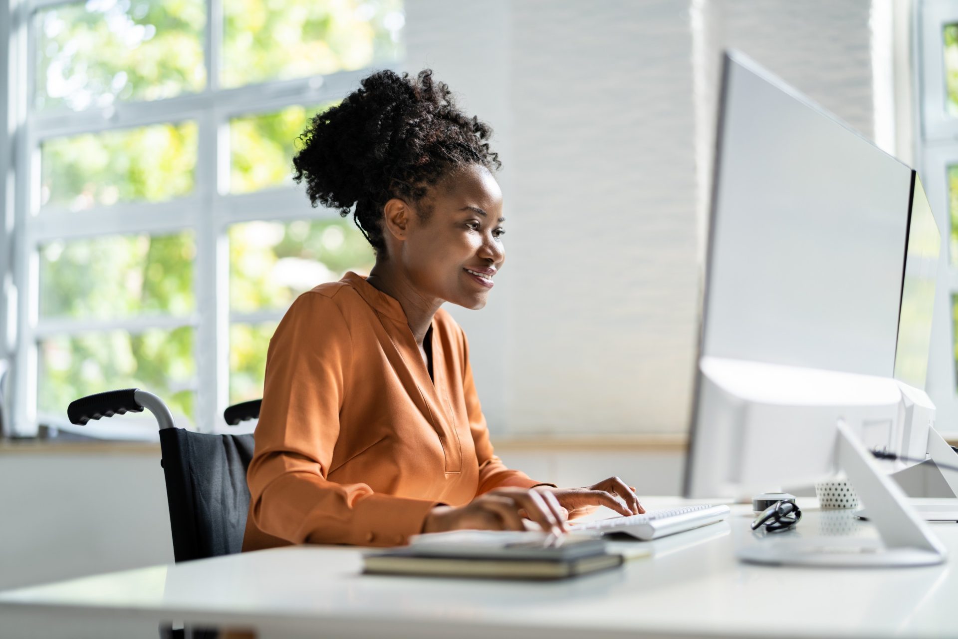 woman looking at a design on her computer.