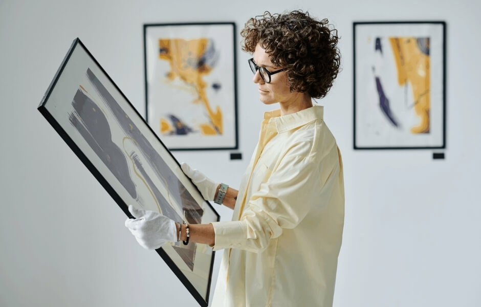 Art collector handling artwork