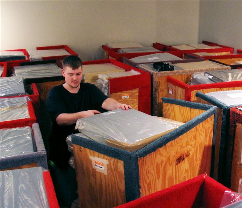 Drew Thomas packing crates at HGG