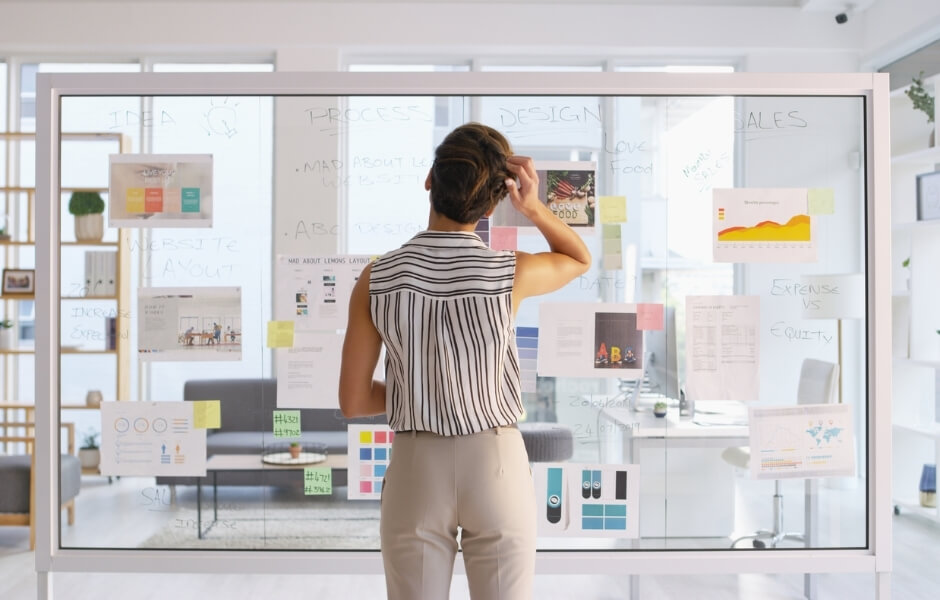 Professional planning a website on a lightboard